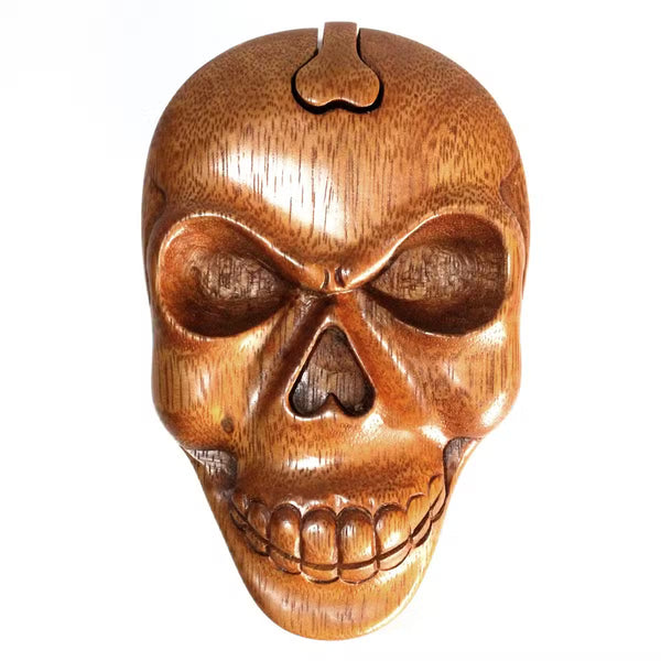 Boîte-puzzle en bois sculpté de Bali en forme de crâne